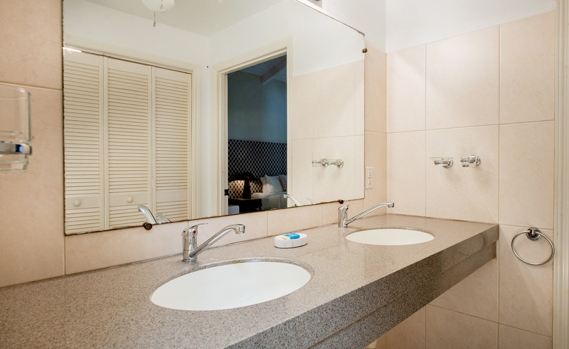 ensuite bathroom with double sink in the marvelous three bedroom penthouse apartment named Dolphin Paradise by Curacao Luxury Holiday Rentals