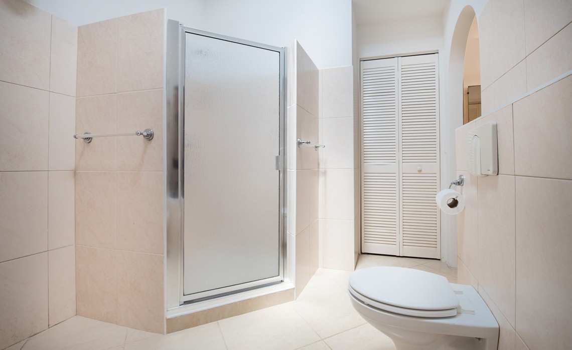 ensuite bathroom with warm water shower in the marvelous three bedroom penthouse apartment named Dolphin Paradise by Curacao Luxury Holiday Rentals