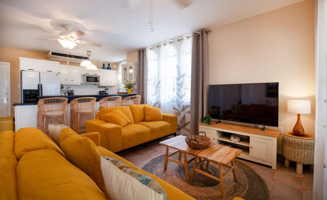 Open‑plan living‑room‑dining space in the Portofino two‑bedroom apartment