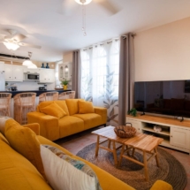 Open‑plan living‑room‑dining space in the Portofino two‑bedroom apartment